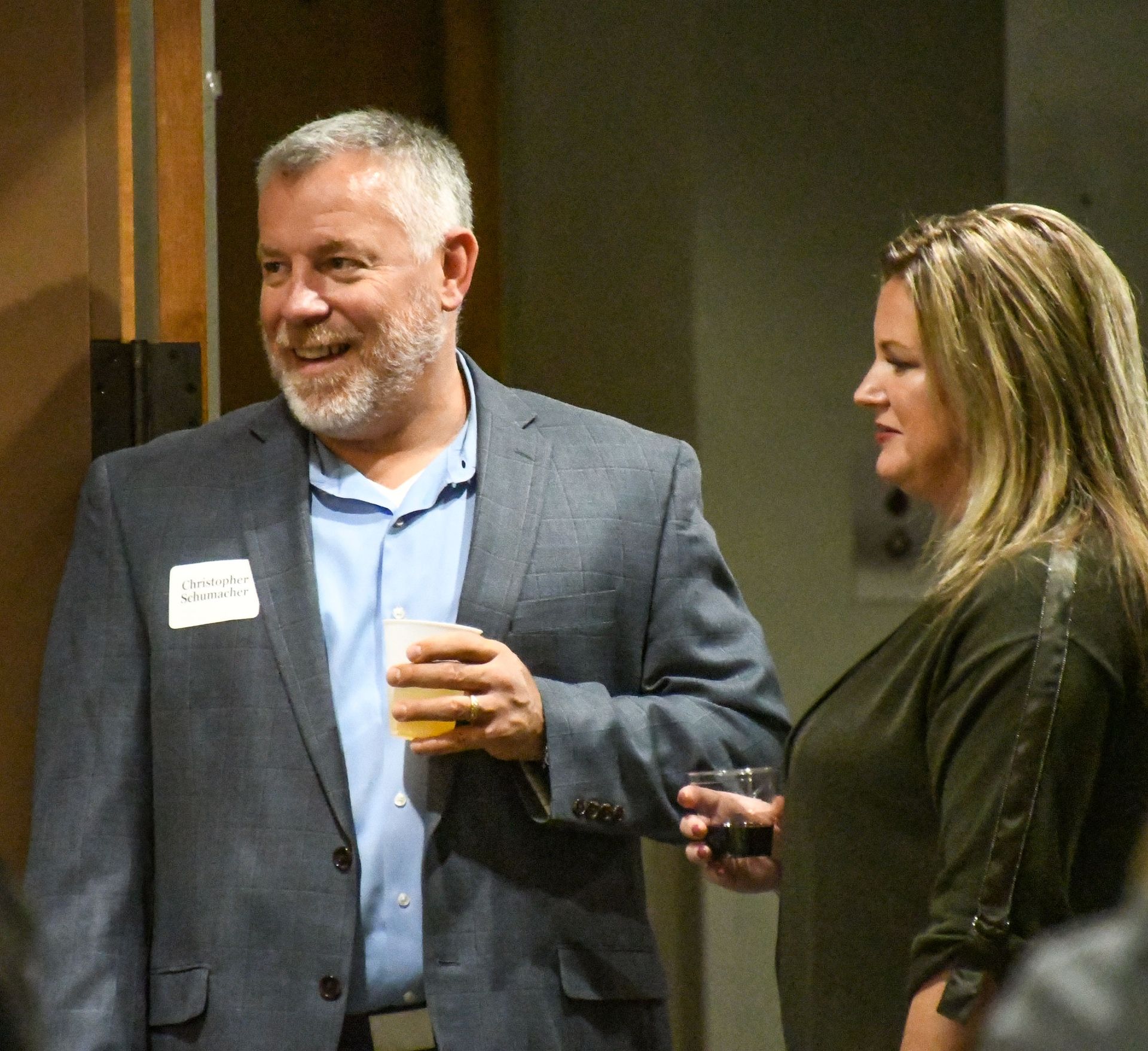 A smiling couple, standing