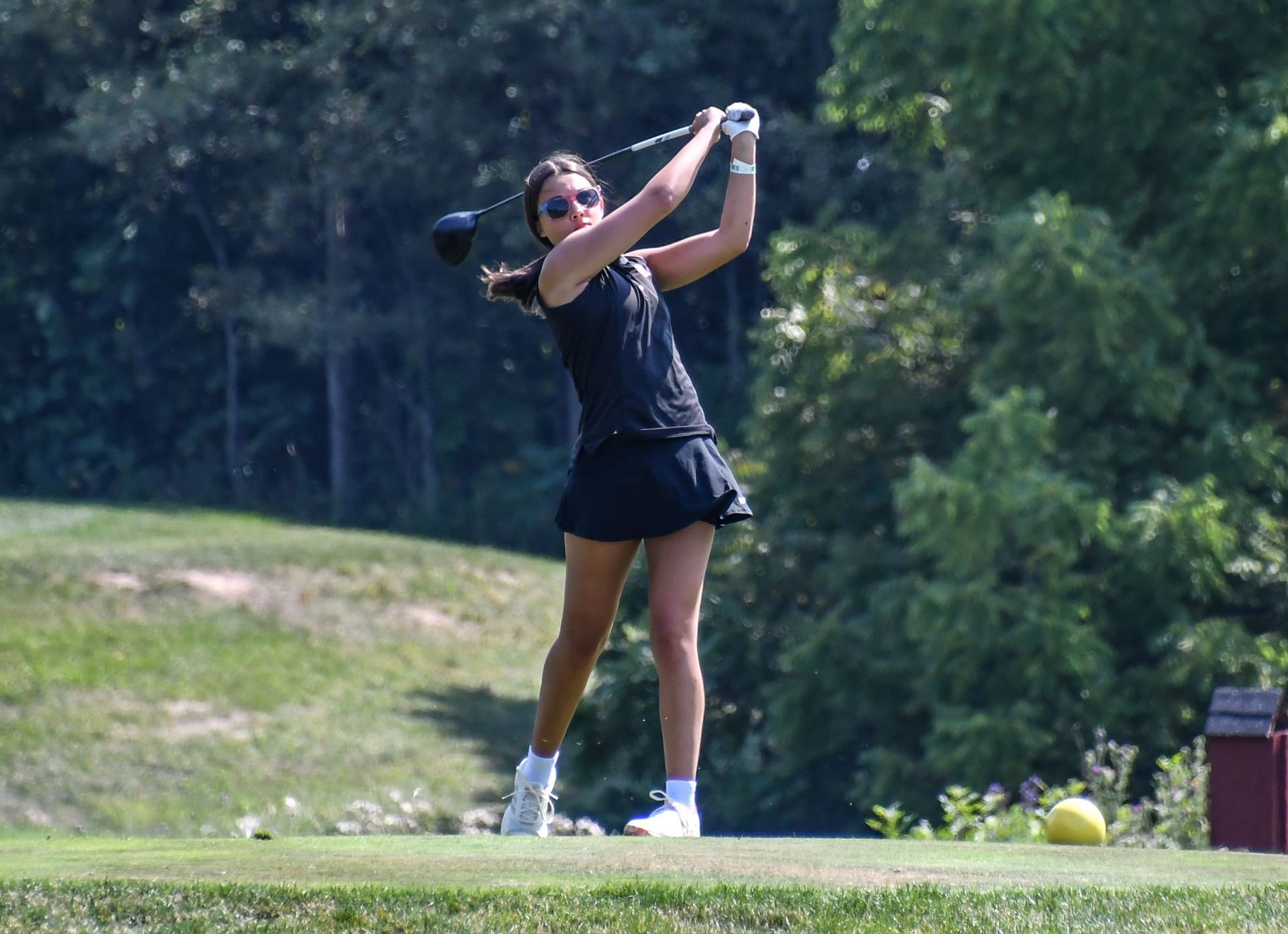 Lauren Movrich taking a swing on the golf course