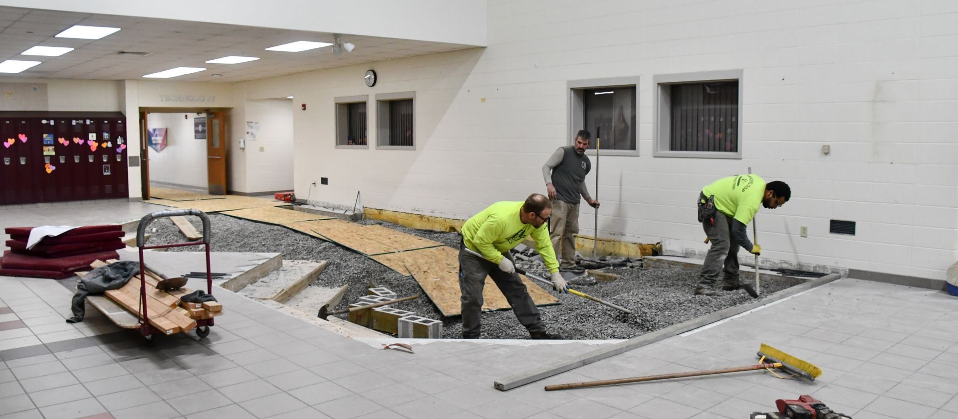 Pits are being filled in with gravel and it is being leveled