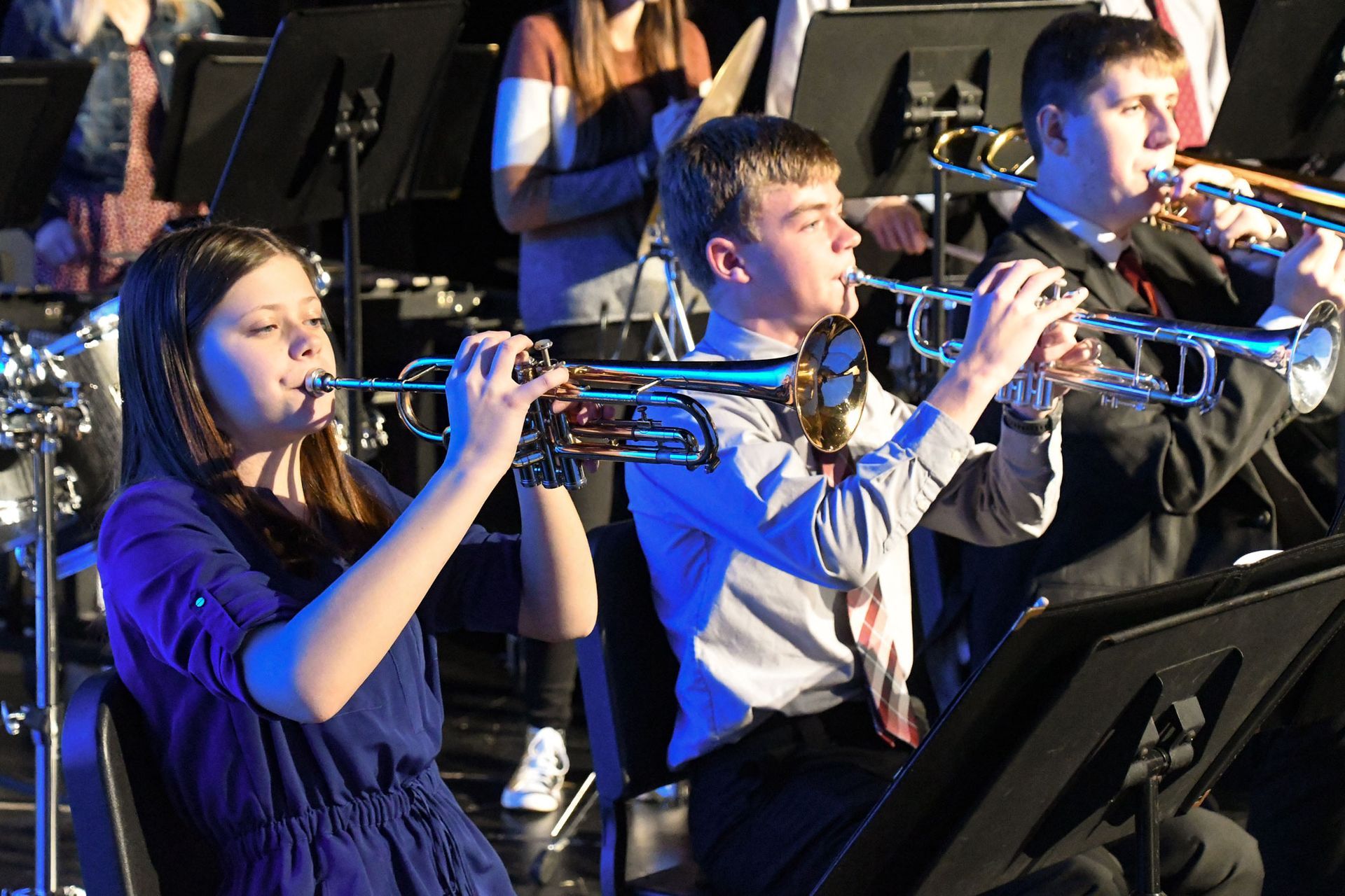 Students playing the trumpet during the service