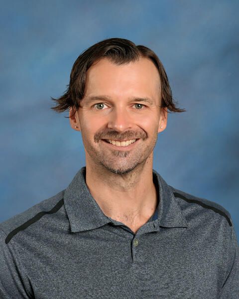 Smiling head shot of Charles Flunker