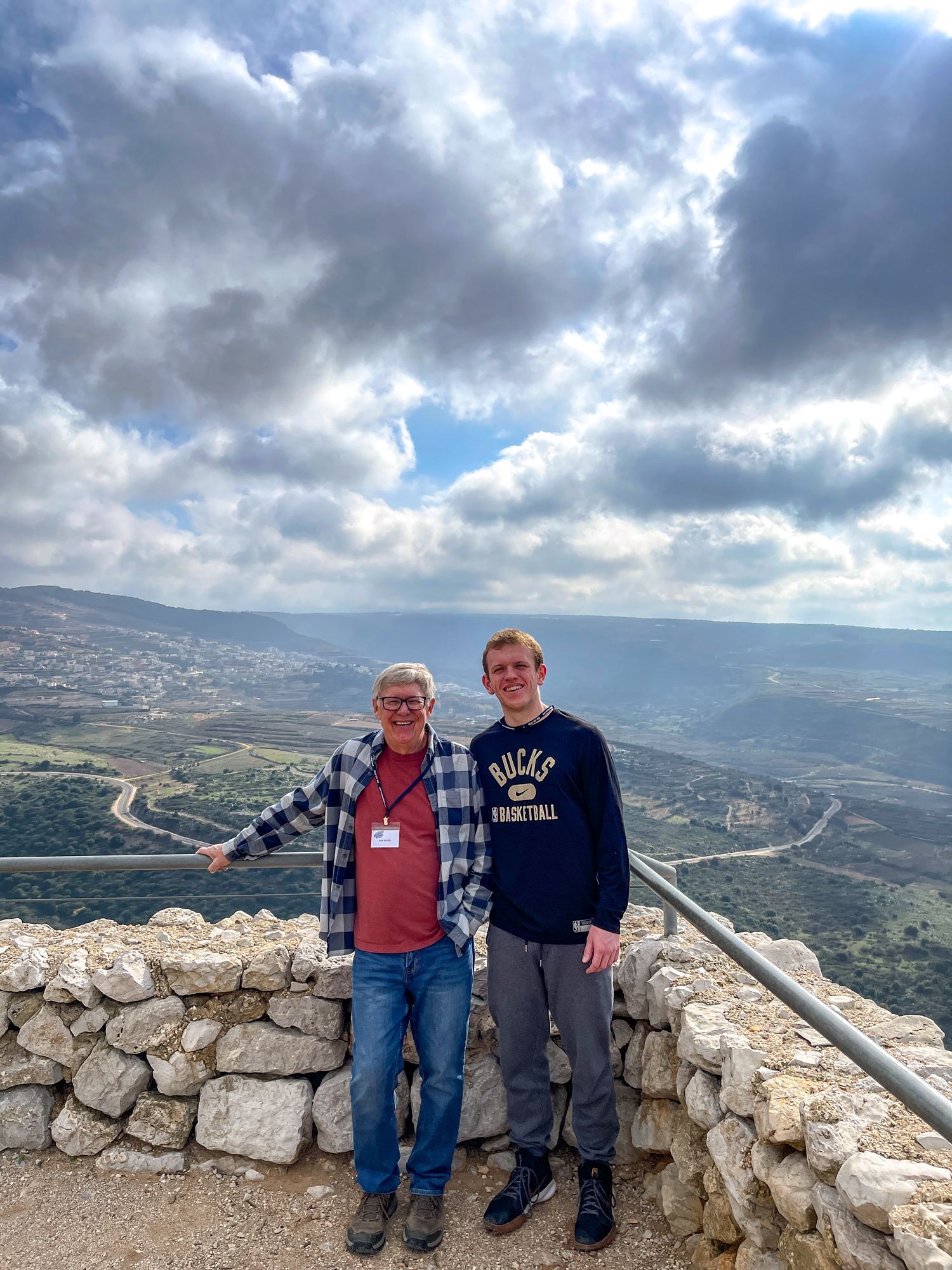 Dan Flynn and Ryan Blobe leaning against a stone wall from the Golan Heights