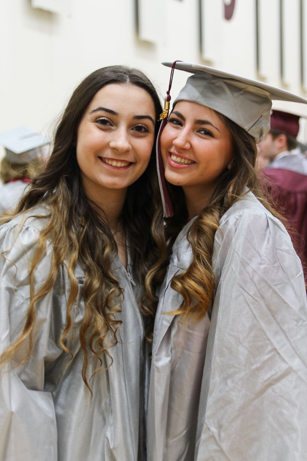Two girls, cheek to cheek, smiling for the camera