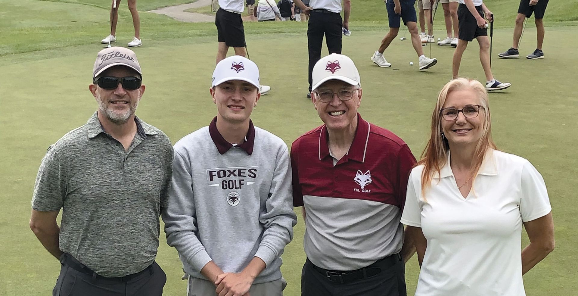 Kaden Kusserow with coach and his parents at state