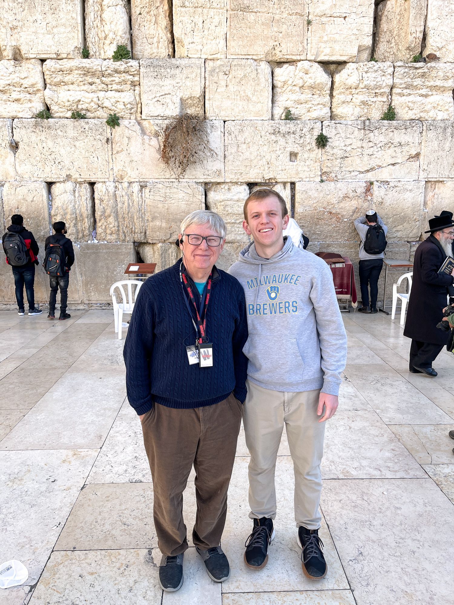 Dan Flynn and Ryan Blobe, standing together, in front of the Western Wall
