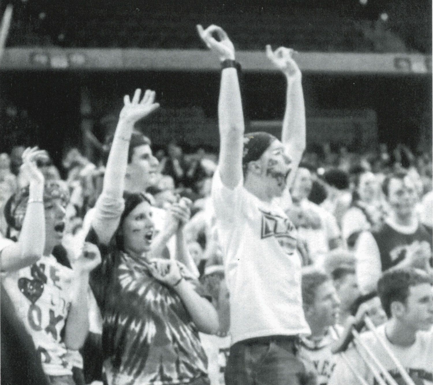 Old yearbook photo of cheering fans at the Kohl Center