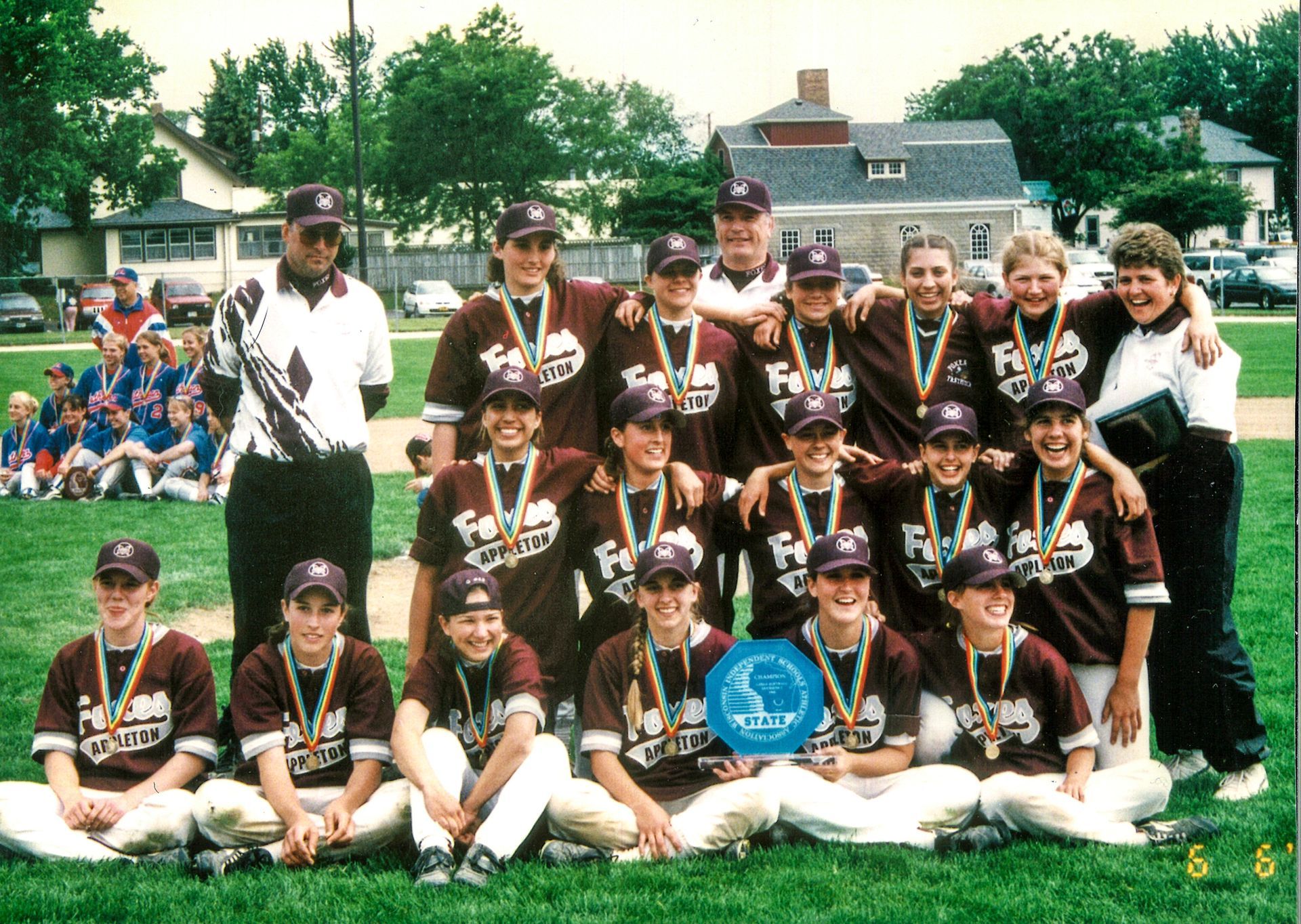 1998 Softball State Championship team, wearing their medals and holding their trophy
