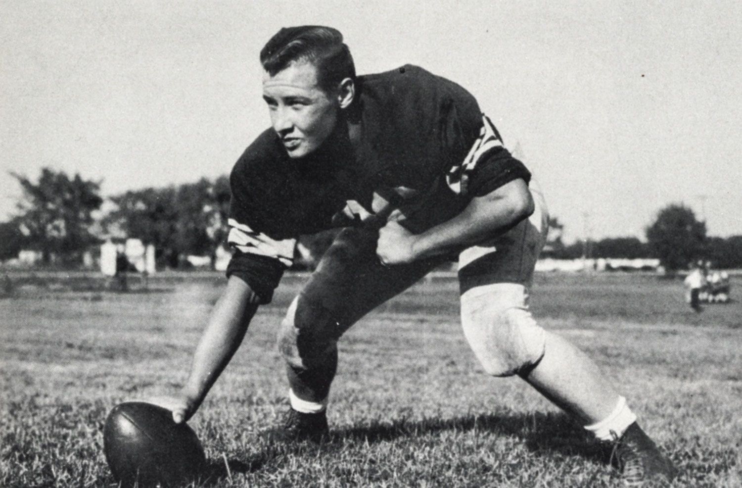 Player posing as if ready to hike the ball