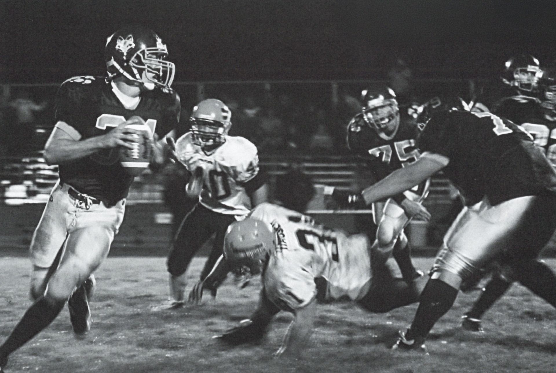 Player getting ready to throw the ball - efforts to tackle him