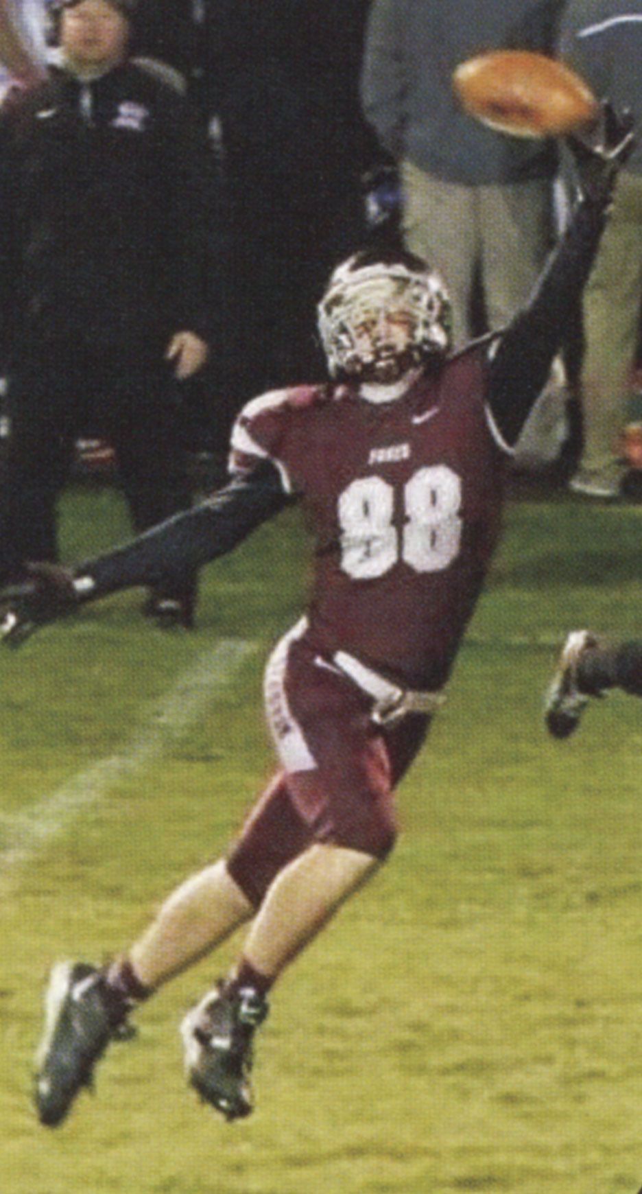 Player stretching to catch the ball