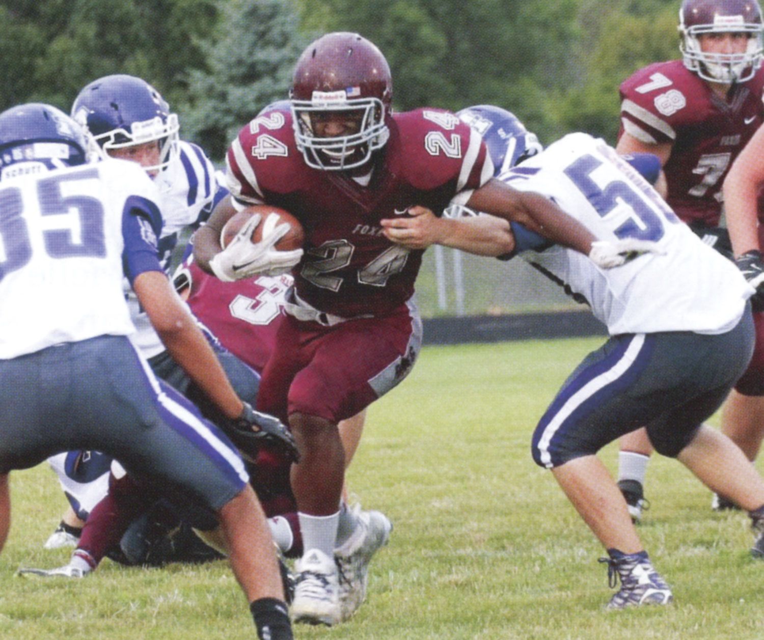 Player protecting the ball and running through opponents