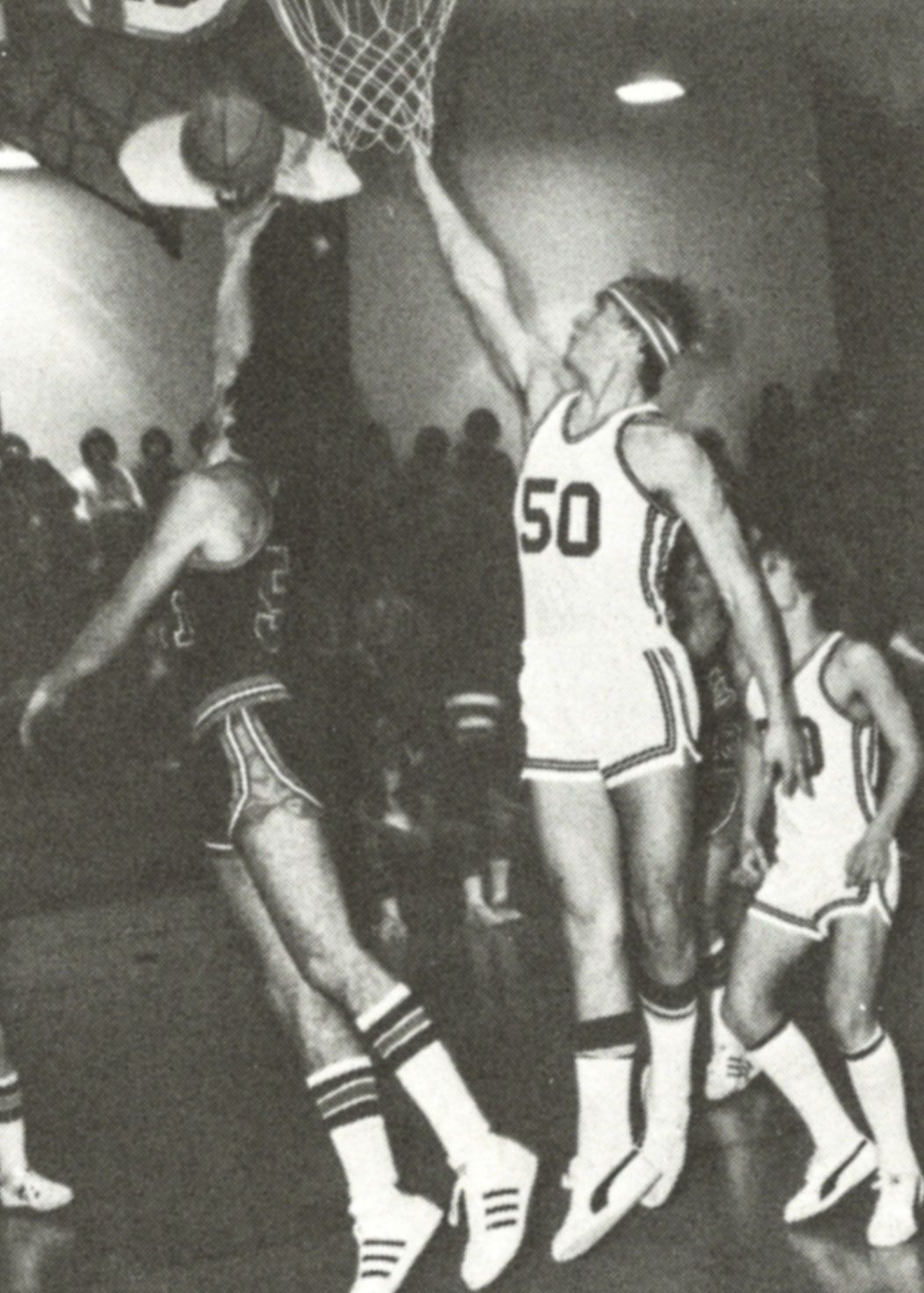 FVL boys team member jumping by the basket to block or rebound