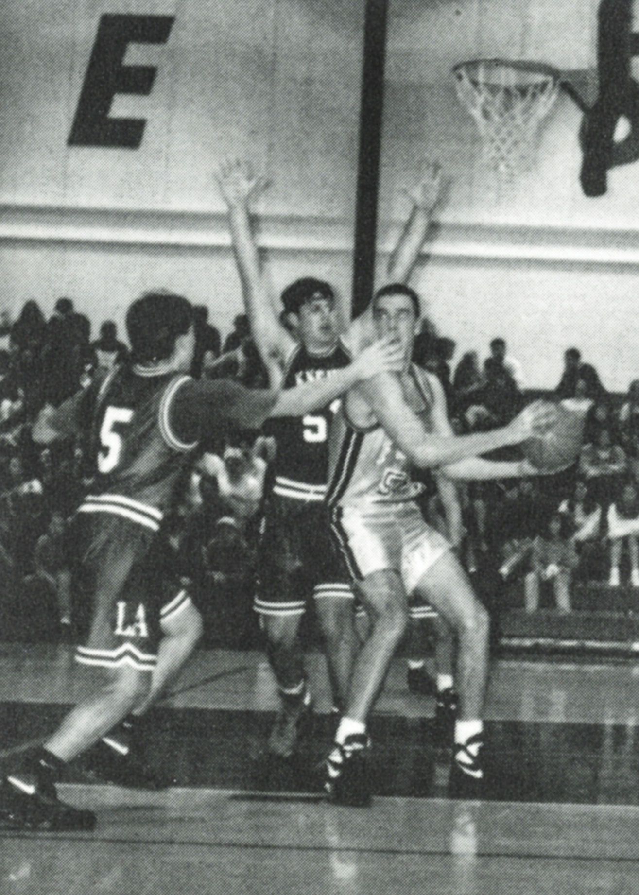 Male FVL basketball team member, looking for an open opportunity to shoot or pass the ball