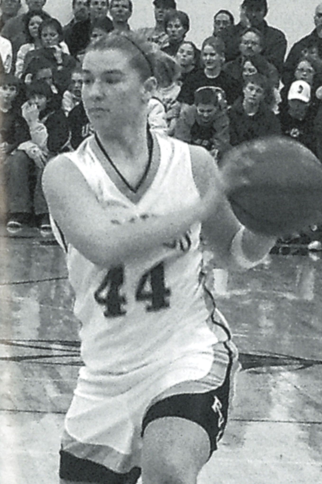 Female maneuvering with basketball