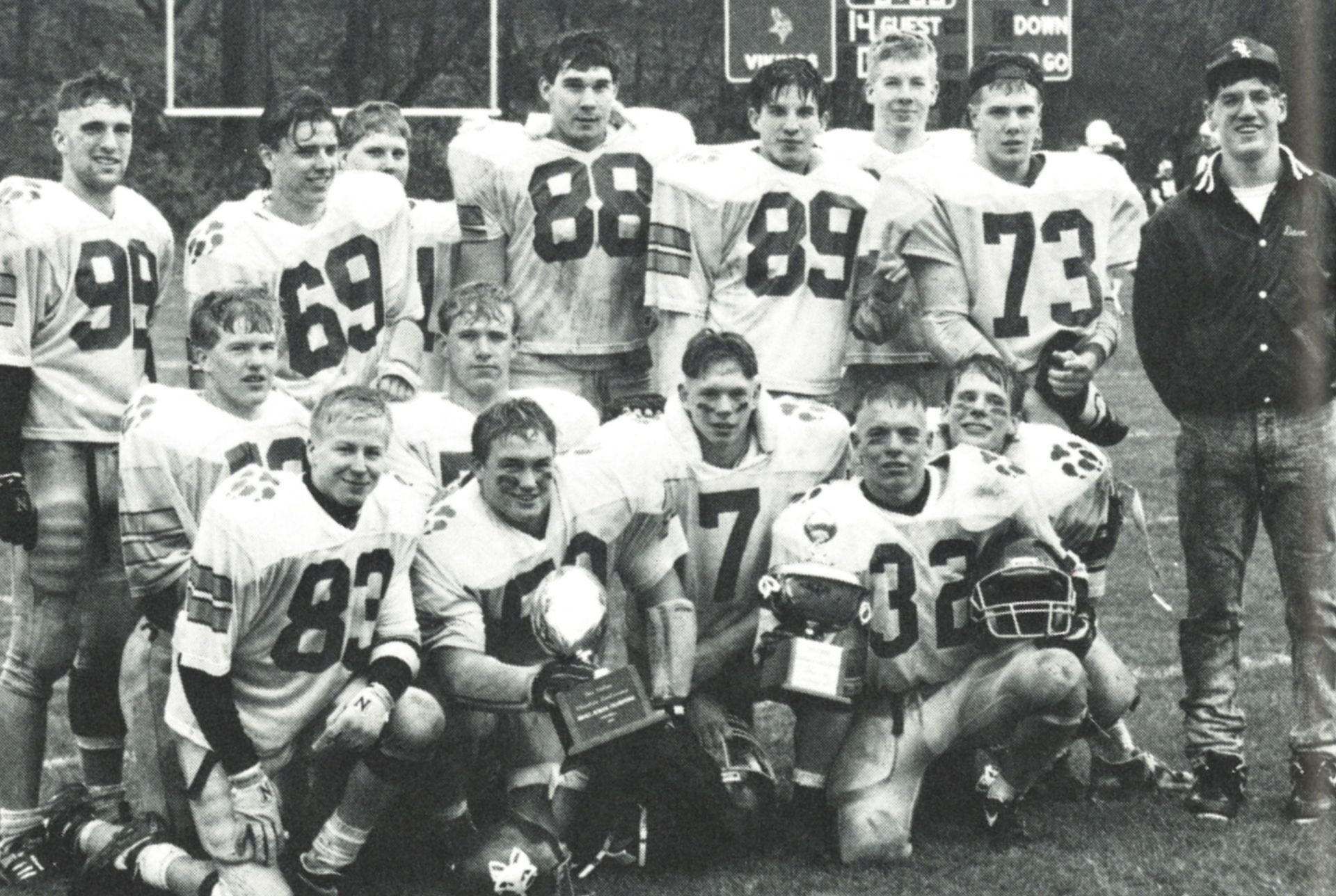 Team holding the Apple Bowl trophy after the game