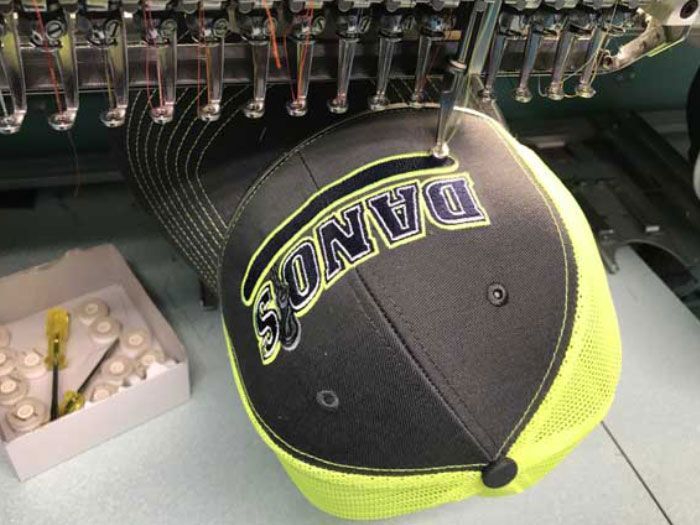 Cap being embroidered with 