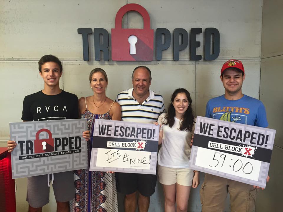 A group of people are holding signs that say `` we escaped ''.