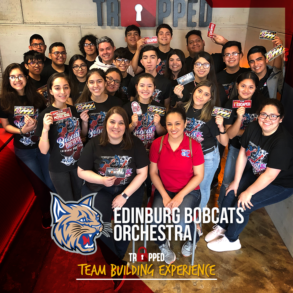 A group of people are posing for a team building experience