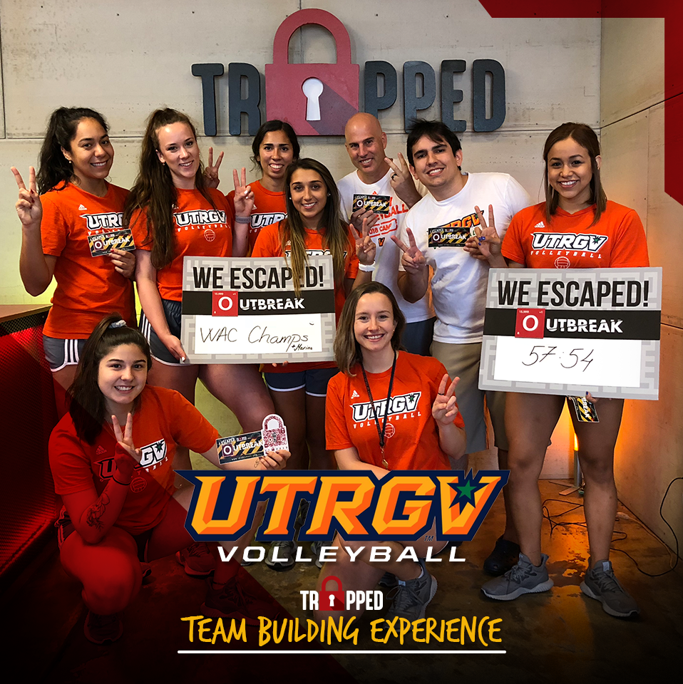 A group of people are posing for a team building experience