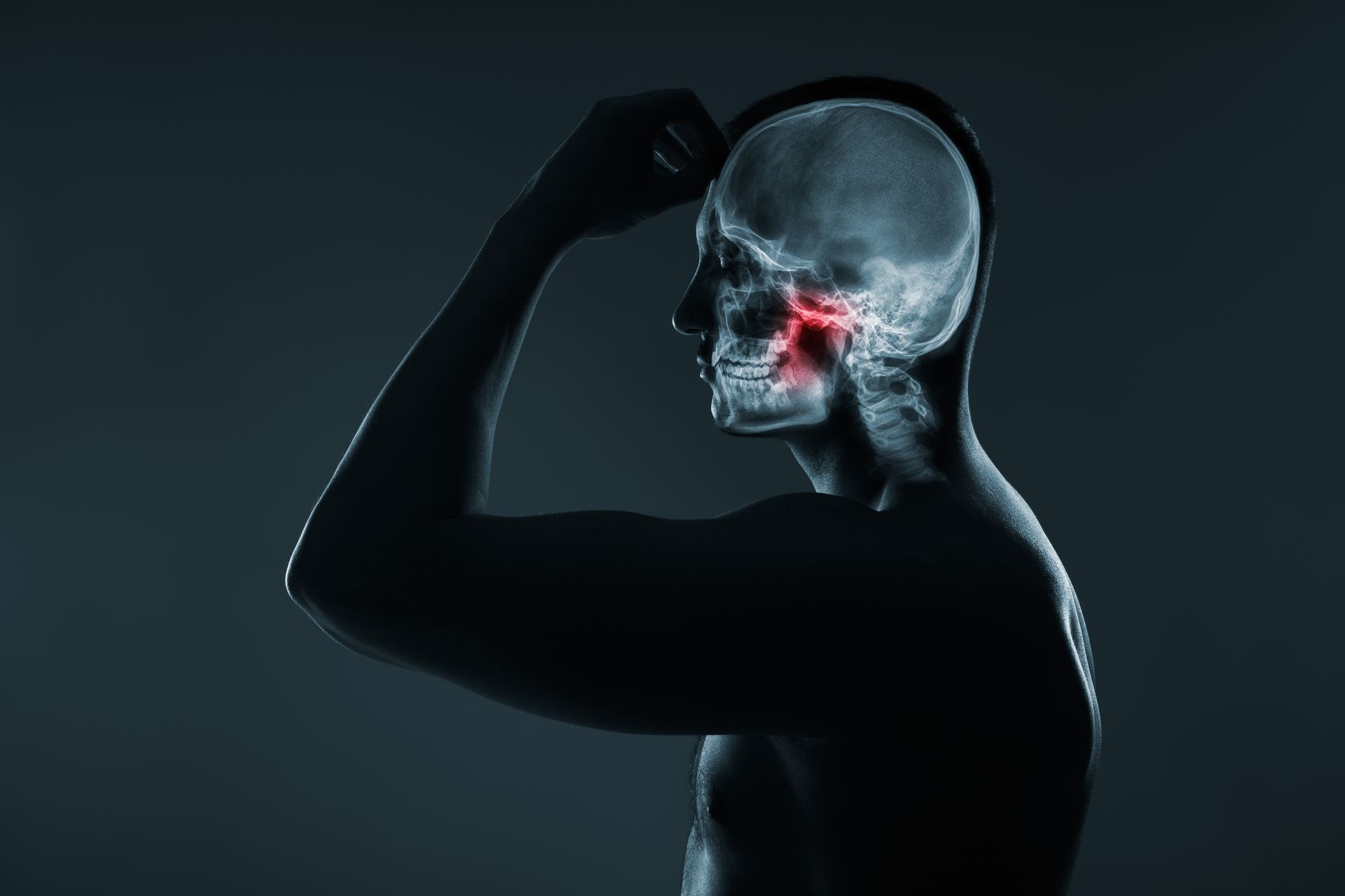 An x-ray of a man 's head with a red spot on it.