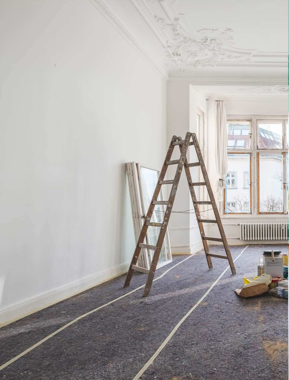 A Wooden Ladder is Sitting in a Room Next to a Window — RPS–Remote Painting Services in White Rock, QLD