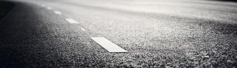 A Black and White Photo of a Road With White Lines on It — RPS–Remote Painting Services in White Rock, QLD