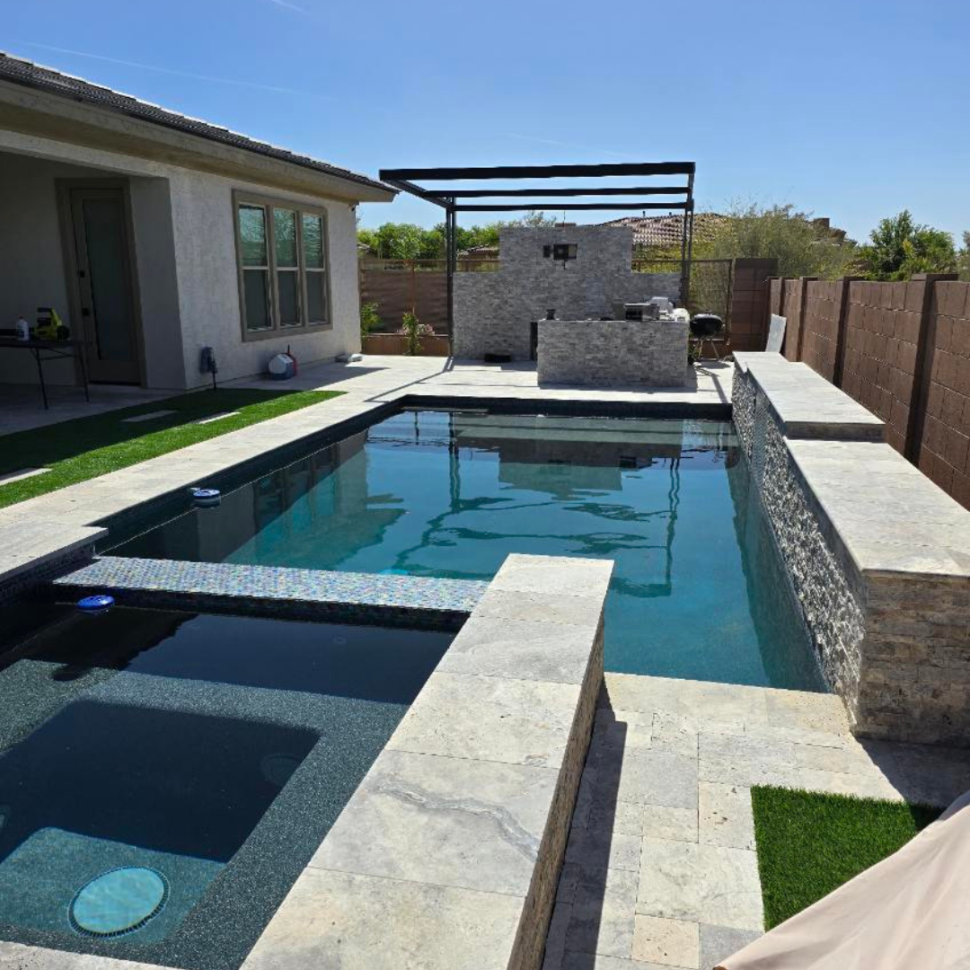 A large swimming pool in the backyard of a house