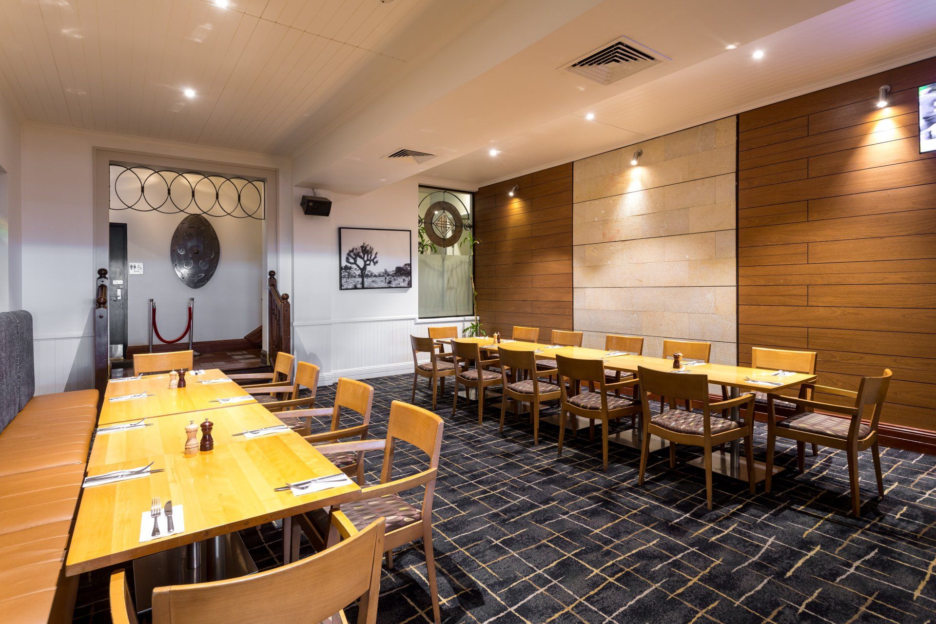 There are many tables and chairs in this room.