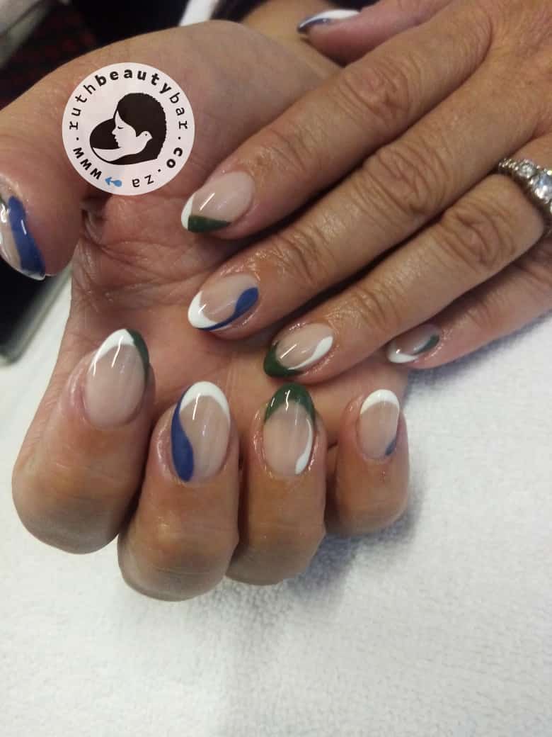 A close up of a woman 's nails with a logo that says beauty