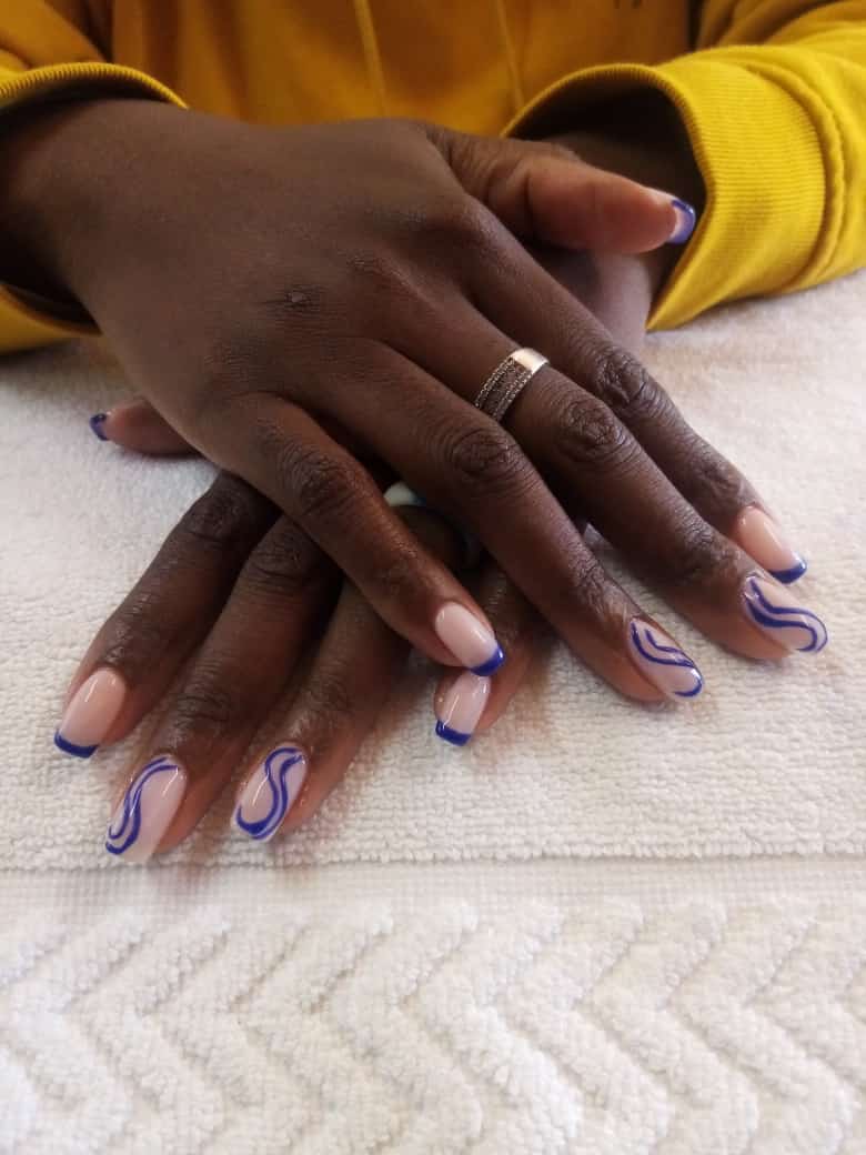 A close up of a woman 's hands with a ring on her finger