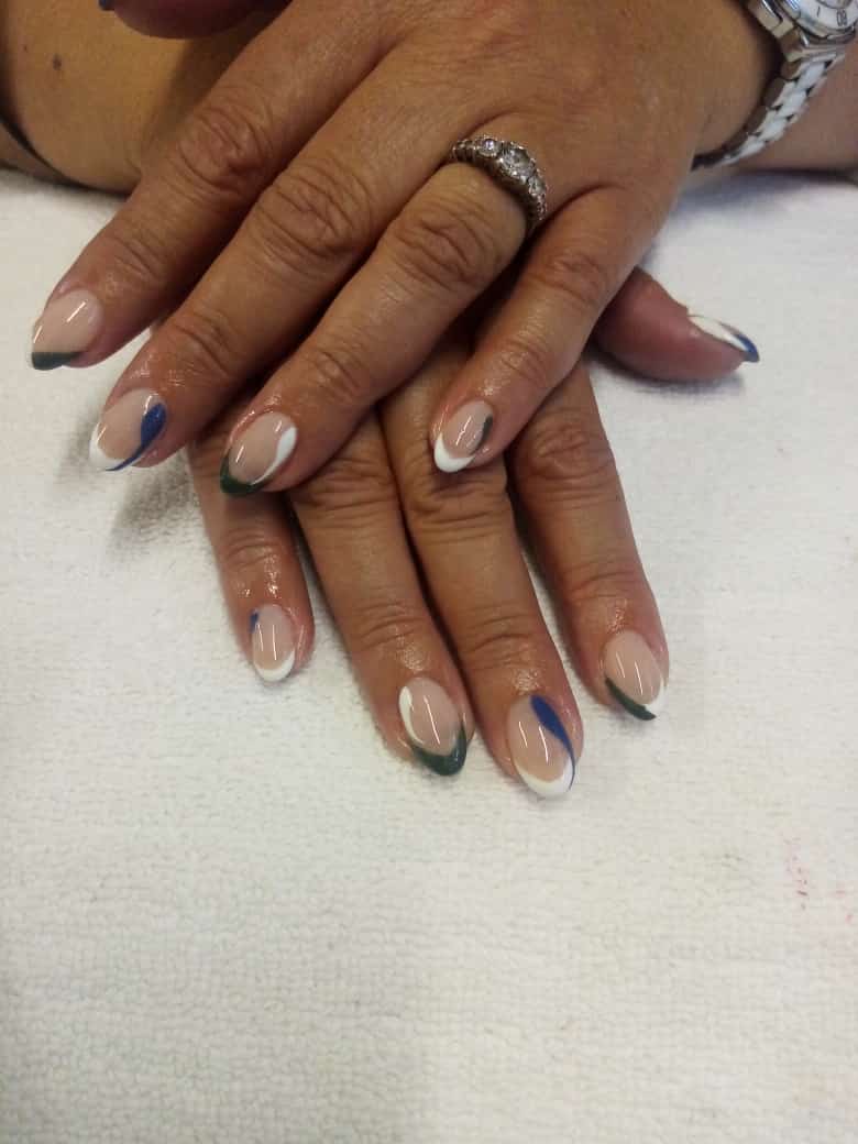 A close up of a woman 's nails with a watch on her wrist