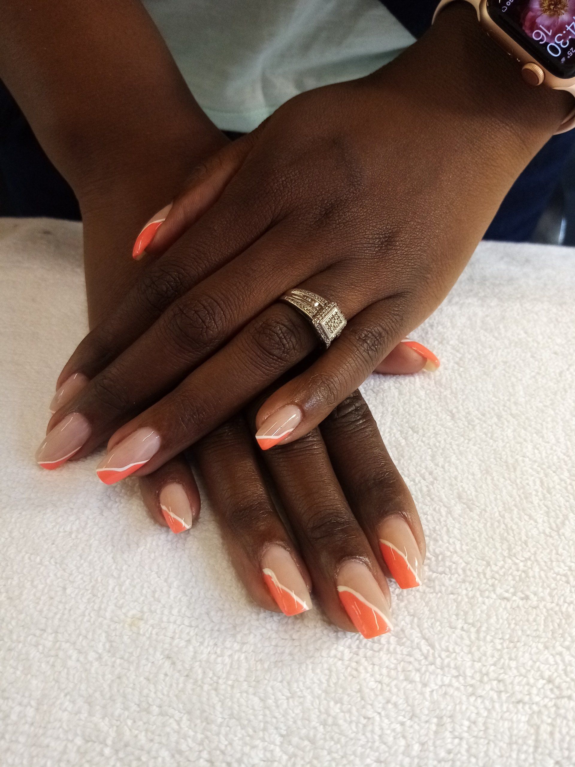 A close up of a woman 's hands with a ring on her finger