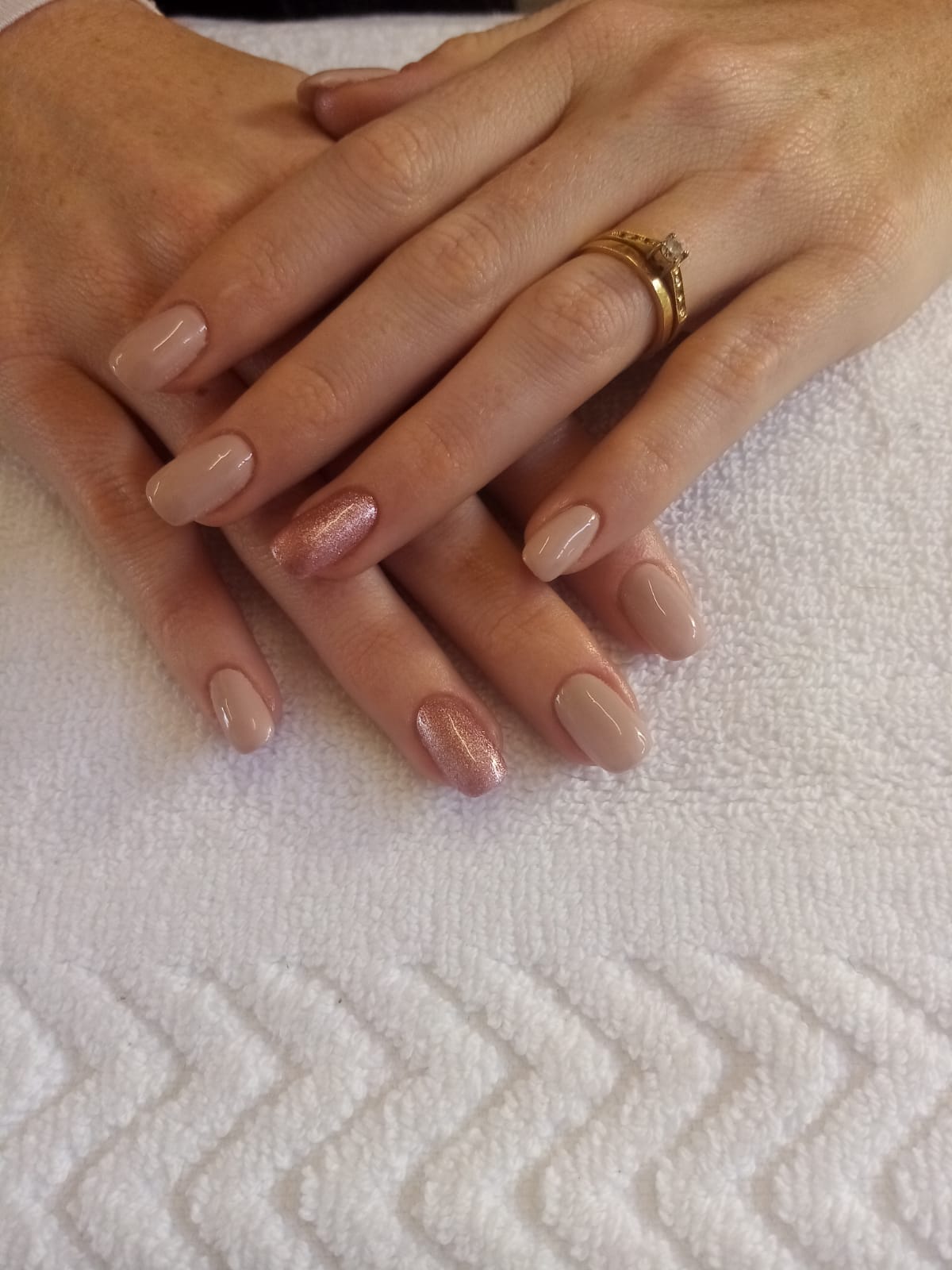 A close up of a woman 's hands with a ring on her finger