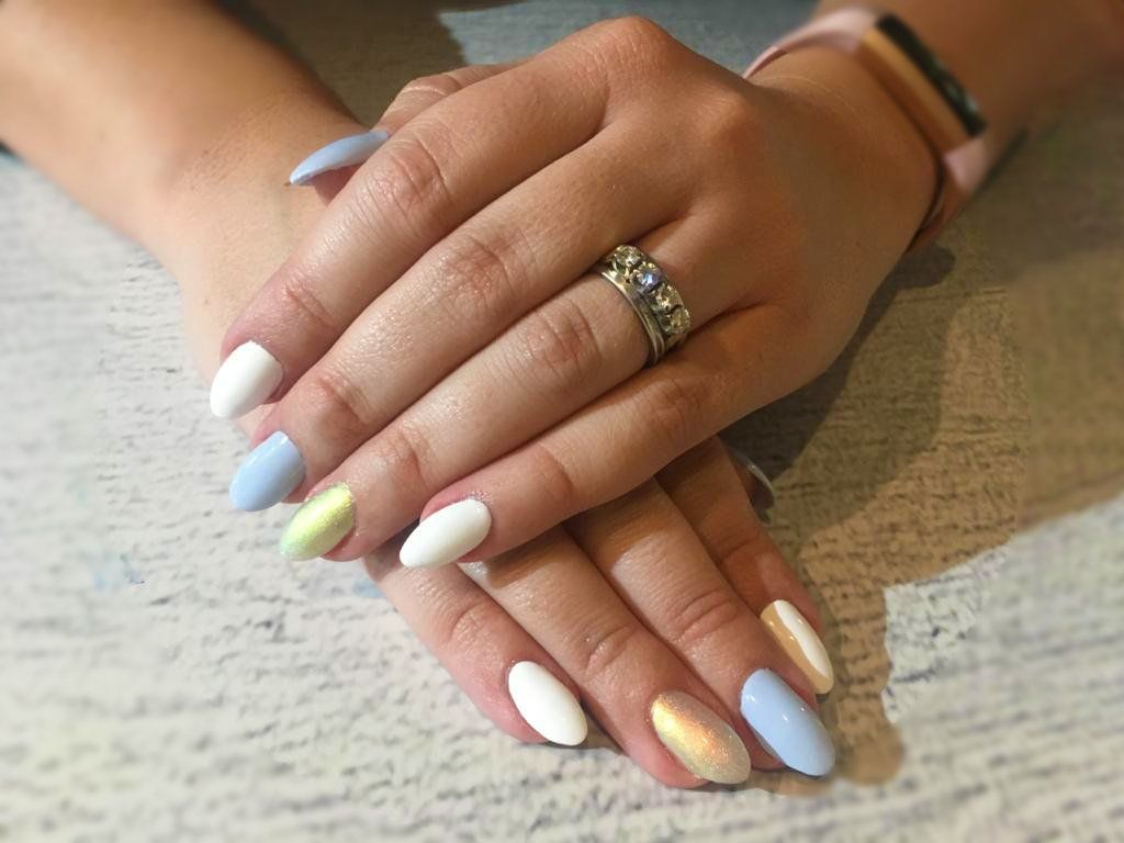 A close up of a woman 's hand with a ring on her finger.