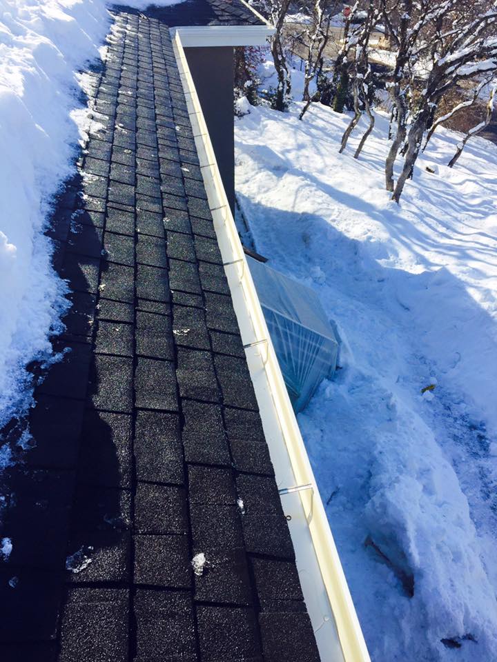 New Installed Gutter — Gutter with Snow in Roof in West Valley City, UT