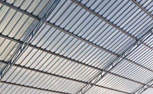Bonded panels in an industrial roof