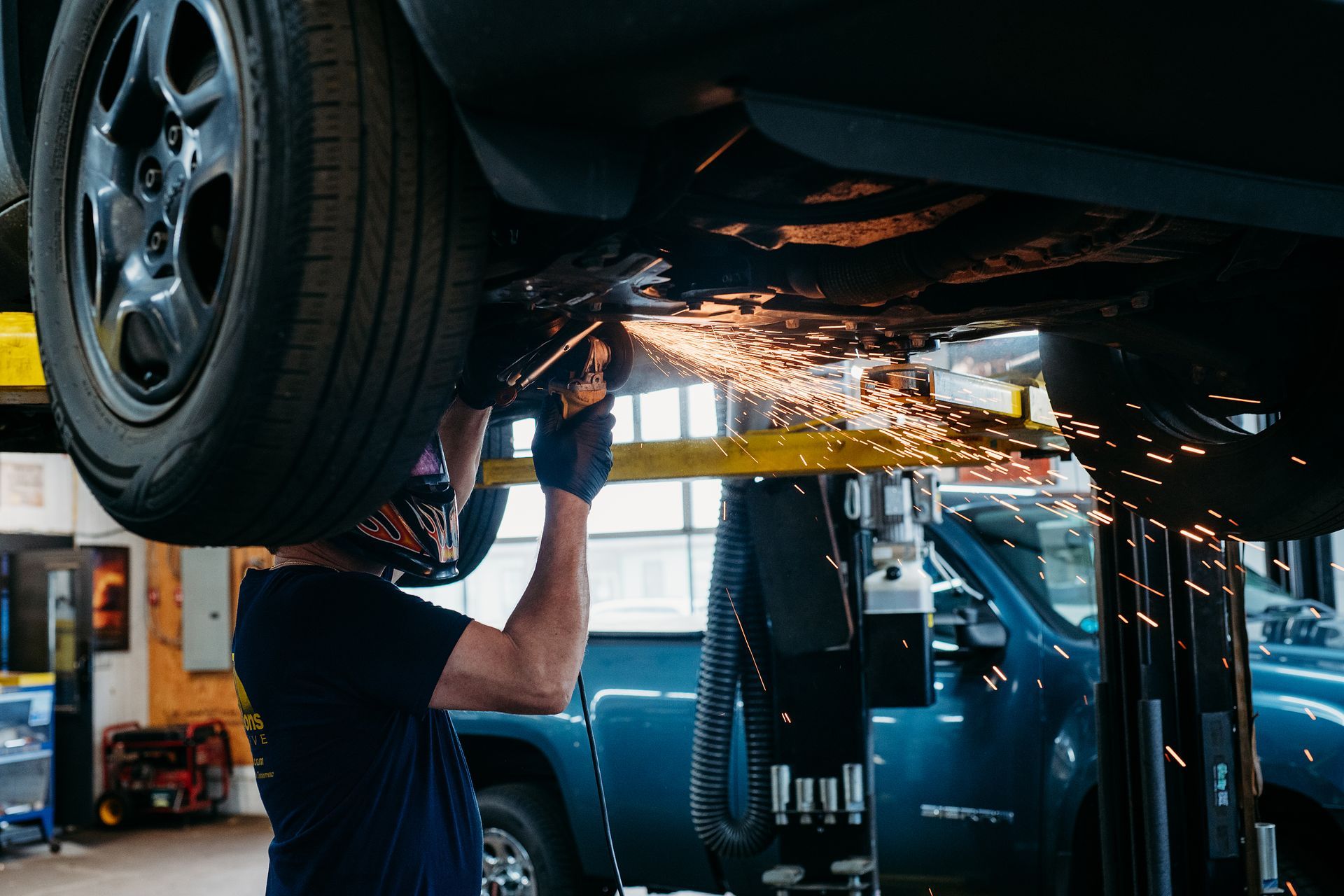 mechanic working under car | Bob and Sons Automotive