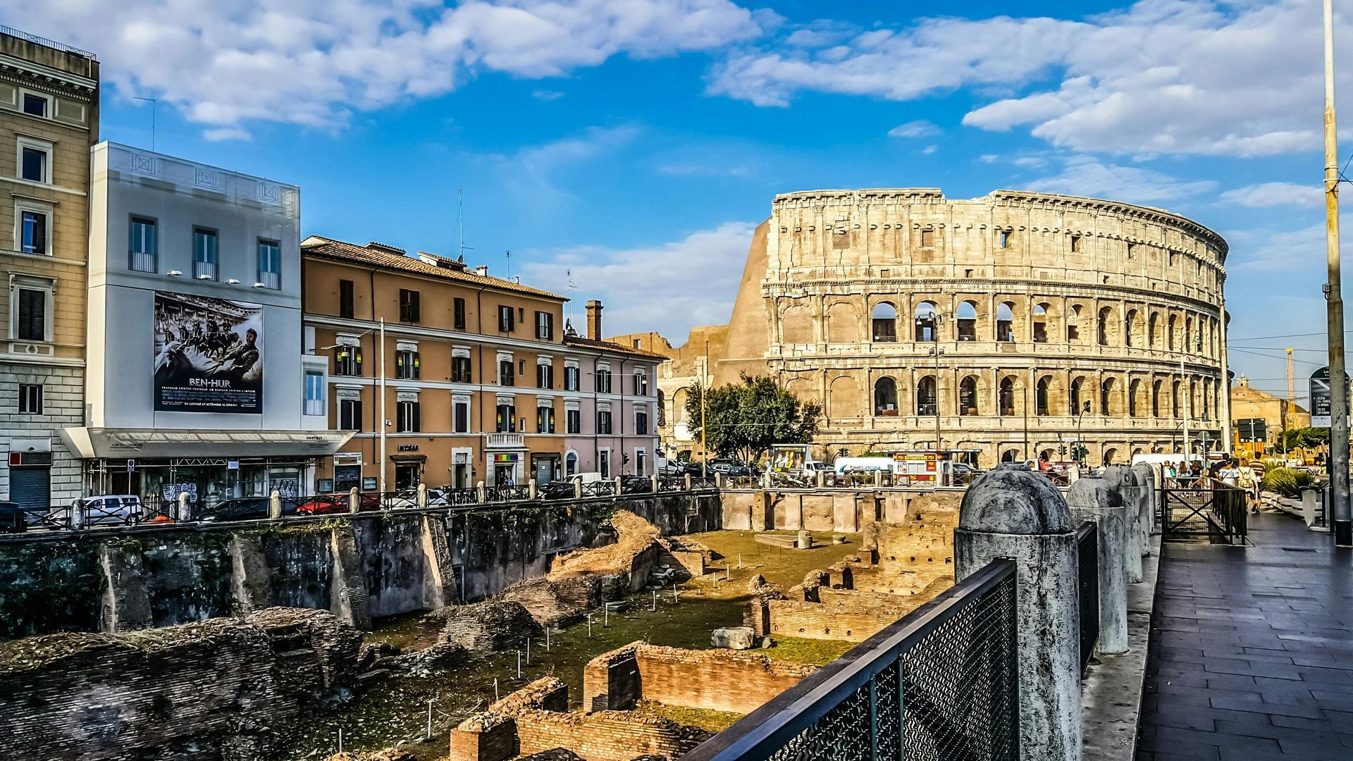 A view of the colosseum from a bridge in rome.