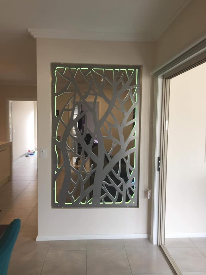 A Room With A Sliding Glass Door And A Wall With A Tree Design On It – Horsham, VIC - ALK Property Maintenance