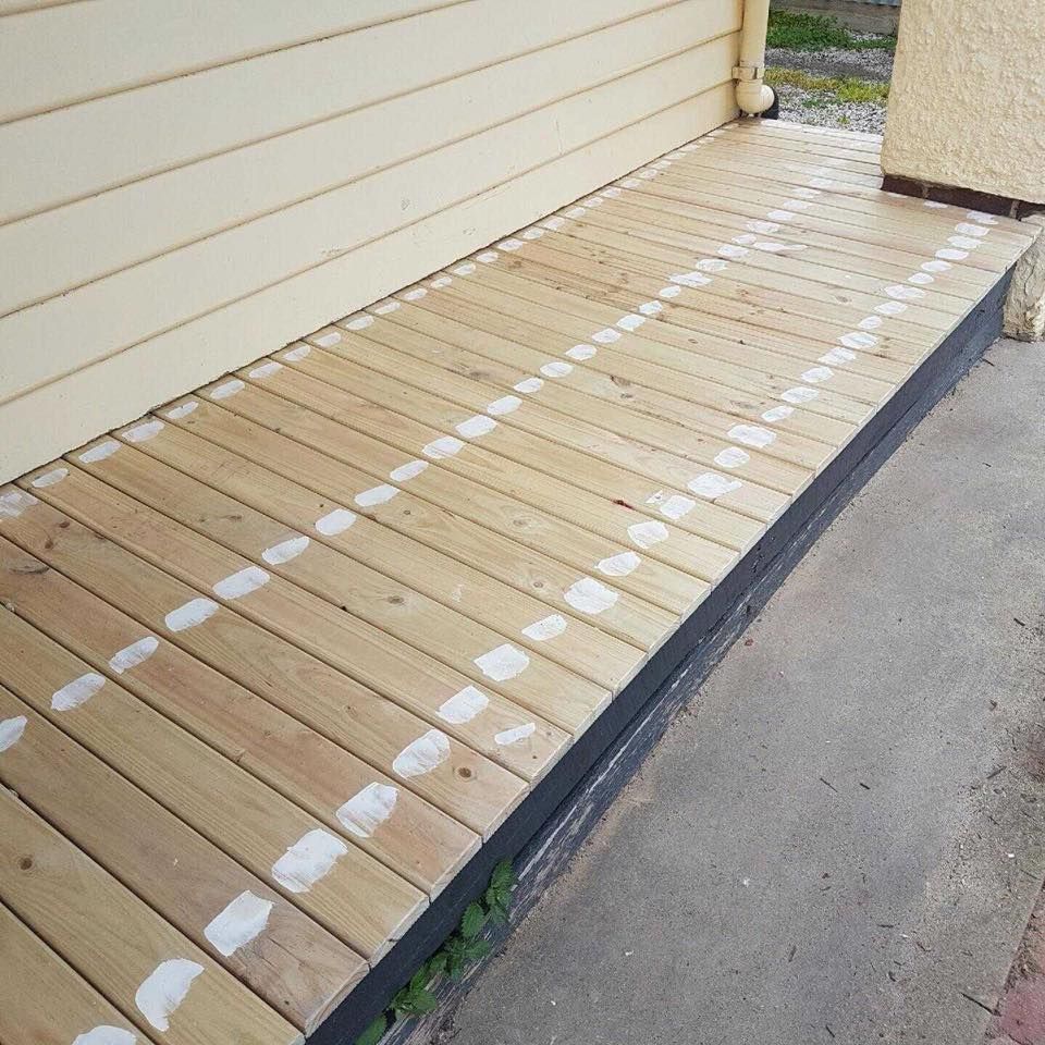 A Wooden Deck With White Lines On It Is Next To A House – Horsham, VIC - ALK Property Maintenance
