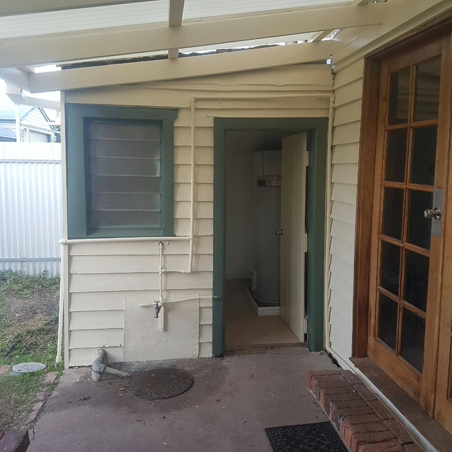 A White House With A Green Door And Window – Horsham, VIC - ALK Property Maintenance