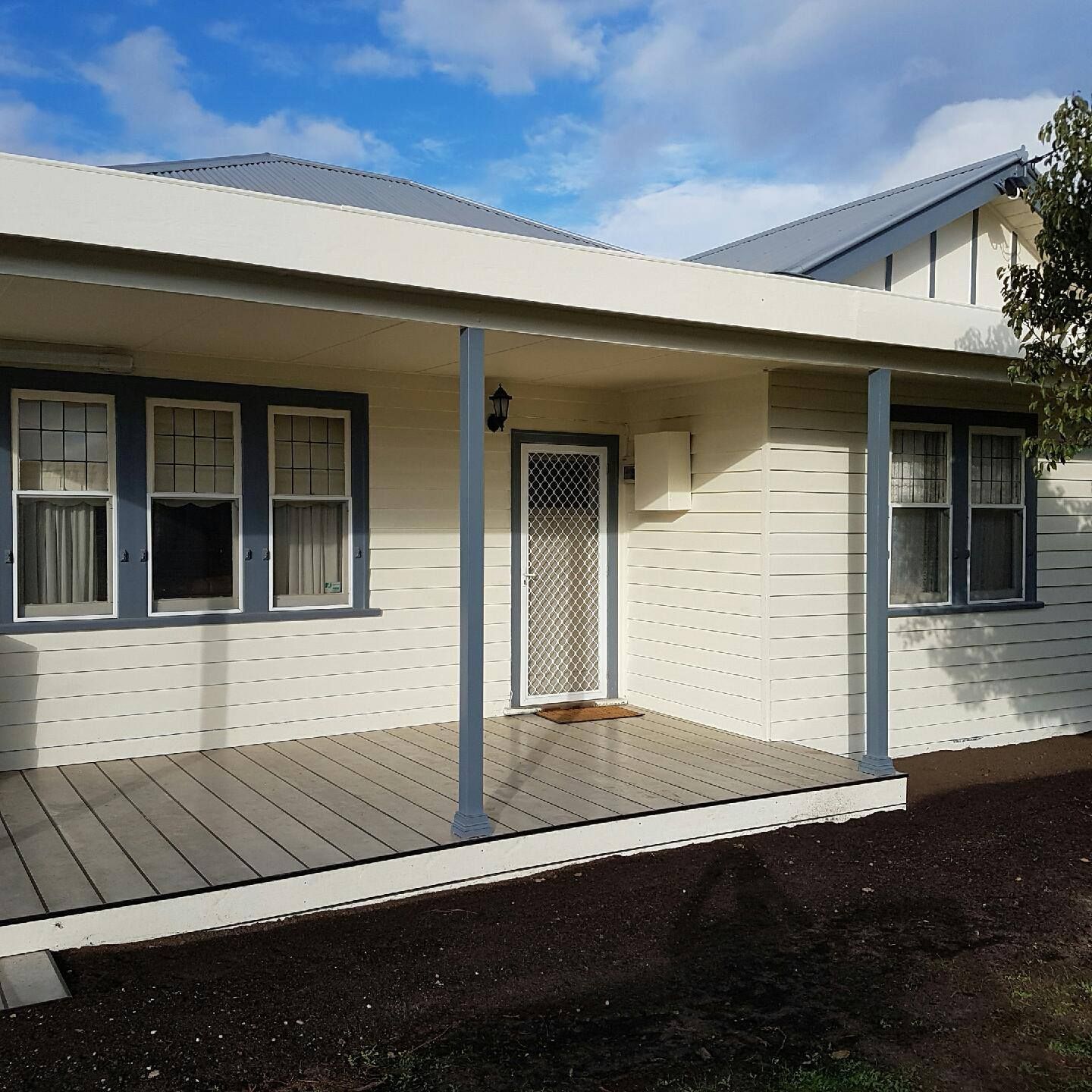 A White House With Blue Trim And A Porch – Horsham, VIC - ALK Property Maintenance