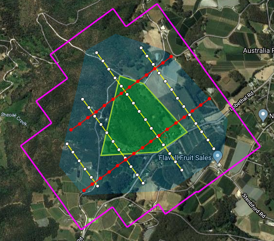 An aerial view of a triangle in the middle of a field