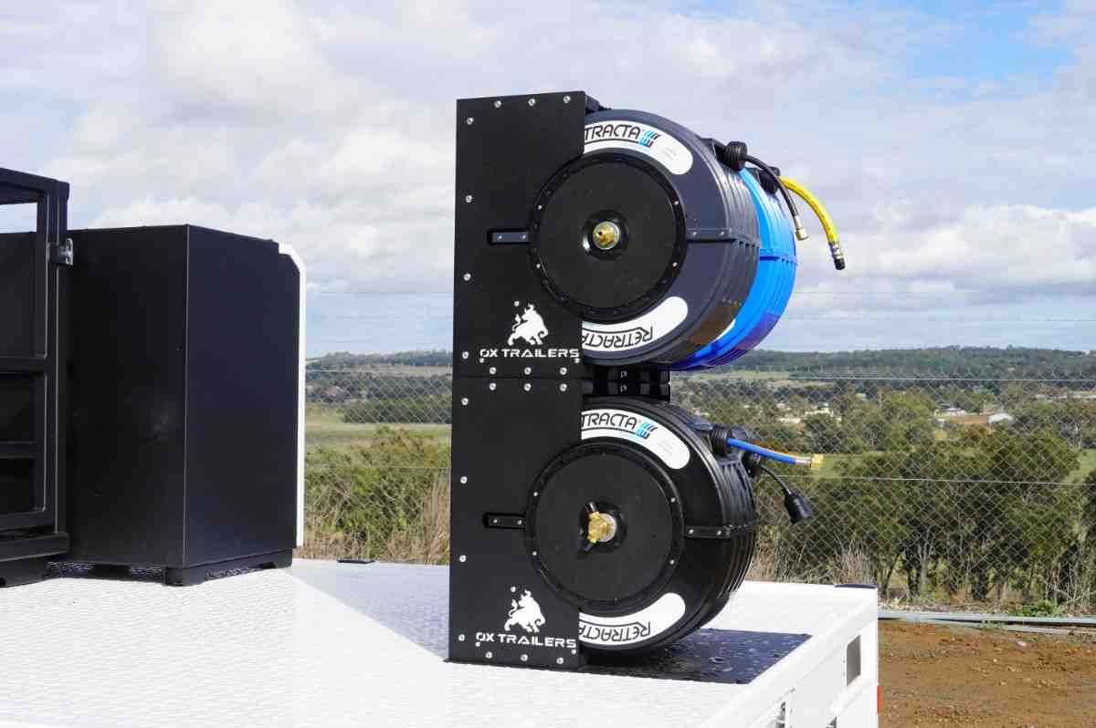 Dual reel and tower unit mounted on a custom 3.5t white trailer for mobile boilermaker trailer setup.