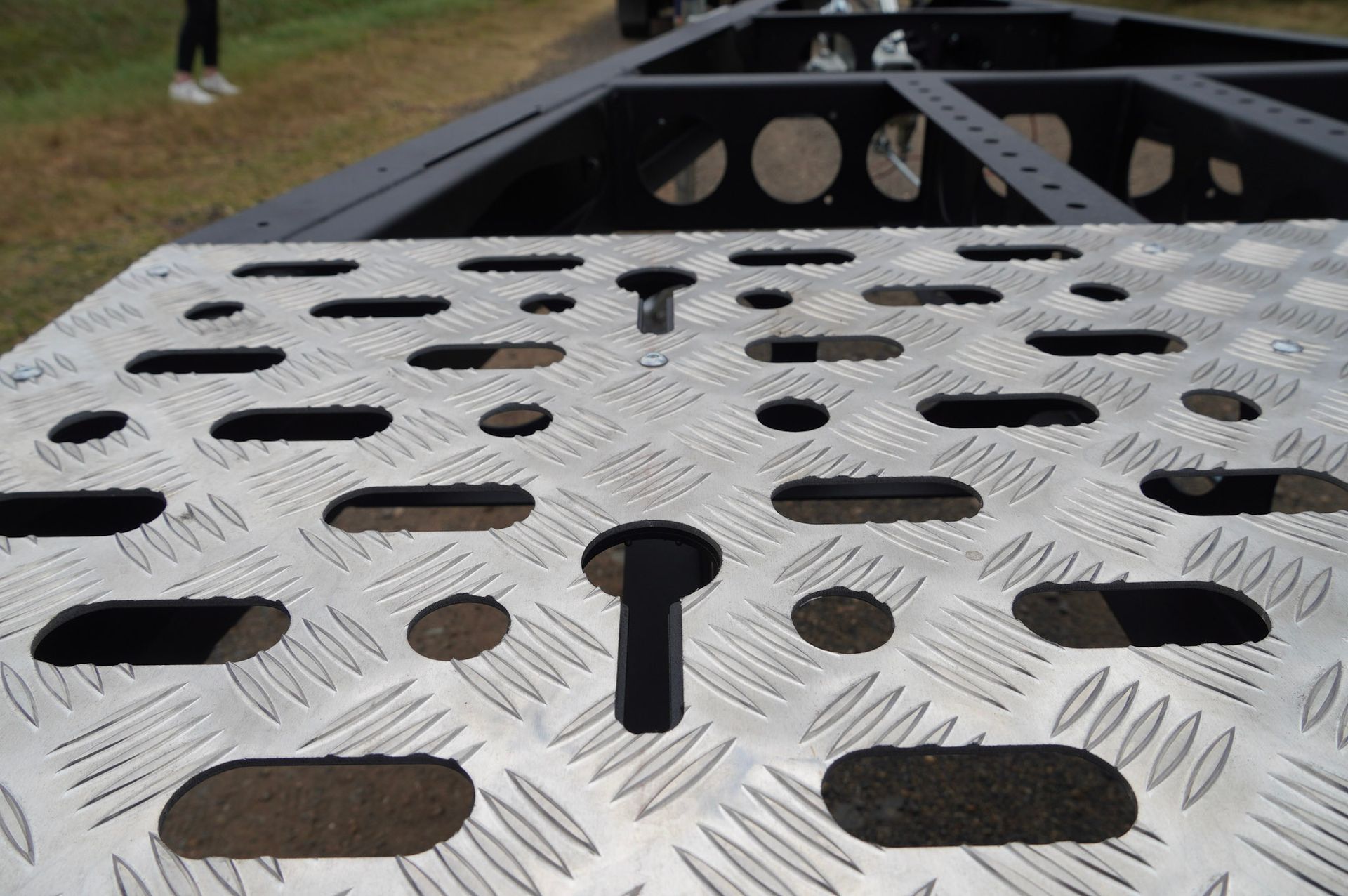 A close up view of one of the Plant Trailers many in-floor chain slots. 