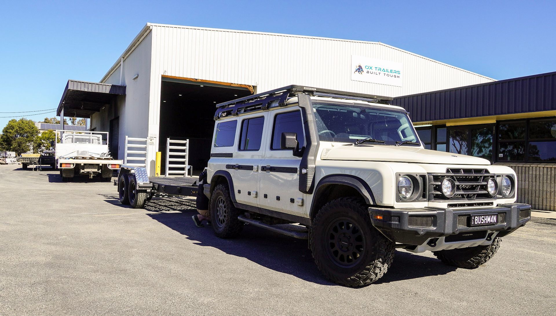 3.5t heavy duty trade series flat top trailer carrying off road vehicle at ox trailers head quarters