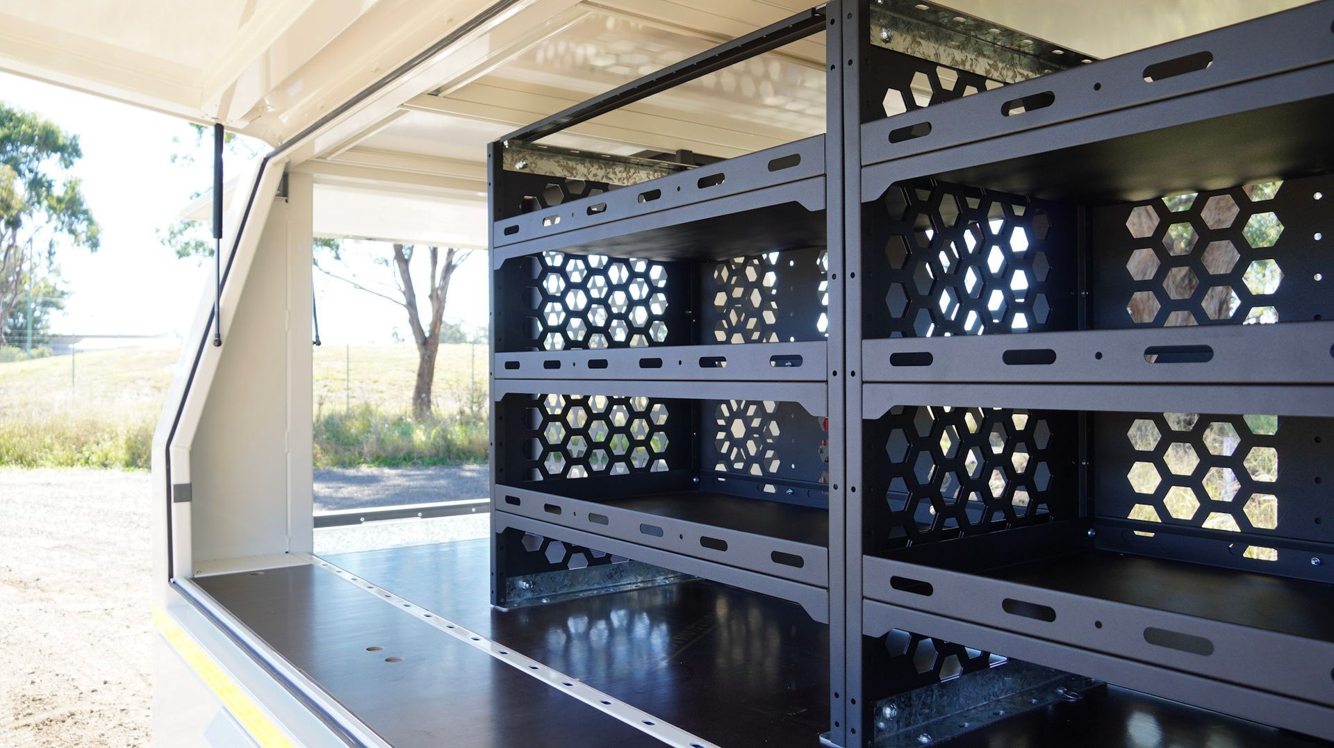 Heavy-duty, adjustable steel shelving in the custom service trailer for Wasco Energy by Ox Trailers
