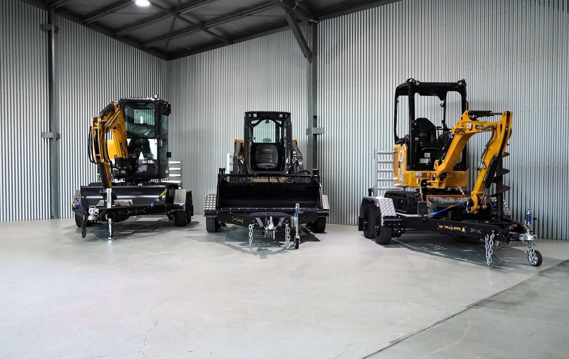 A heavy duty plant trailer delivering an excavator to a construction site.