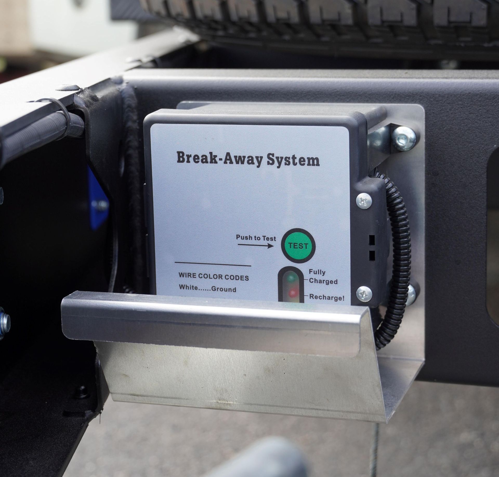 The emergency break-away system installed on a 4.5-ton plant trailer.