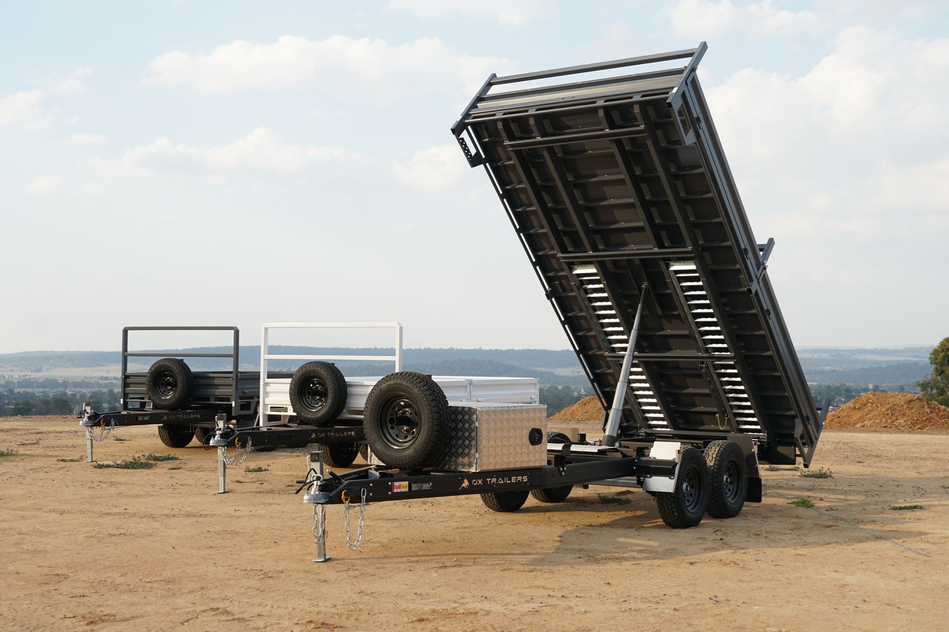 A tipper trailer at full tip while at sand and gravel quarry.